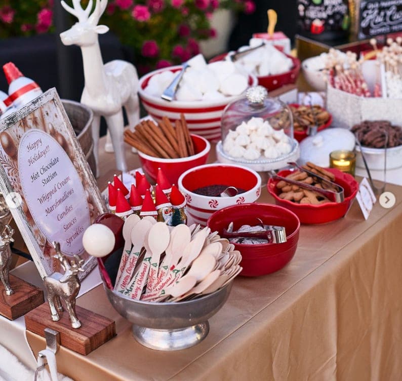 A holiday hot-chocolate station with marshmallows and toppings
